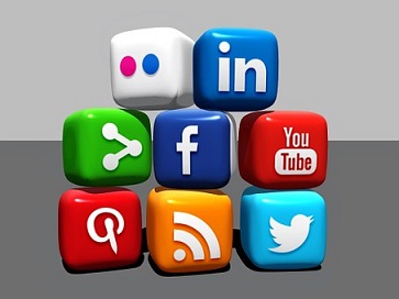 A cartoon of a set of cubes in a pile. Each cube represents an aspect of social media, including linkedin, facebook, blogger, twitter and youtube