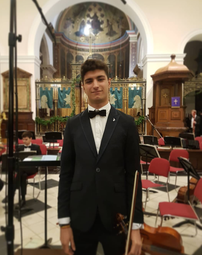 Ignacio in his dinner suit in the orchestra pit of a cathedral