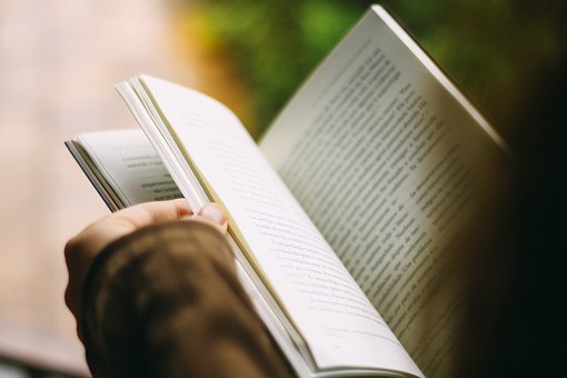 Close up of open book being read