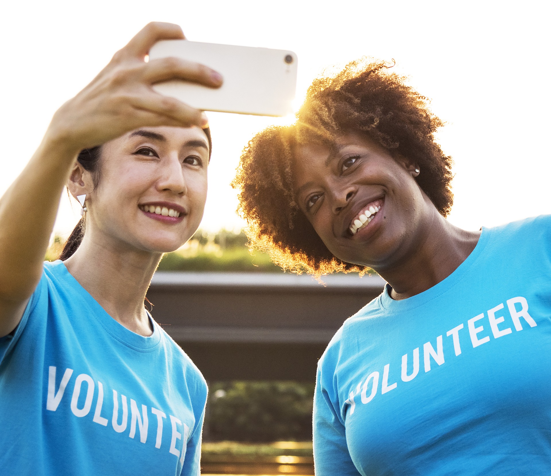 2 volunteers taking a selfie