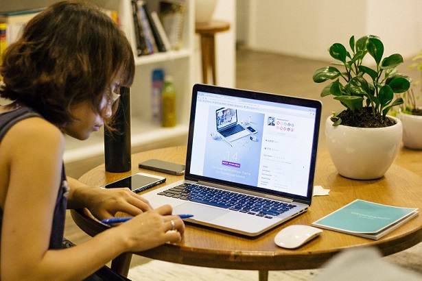 Student working on a laptop at home