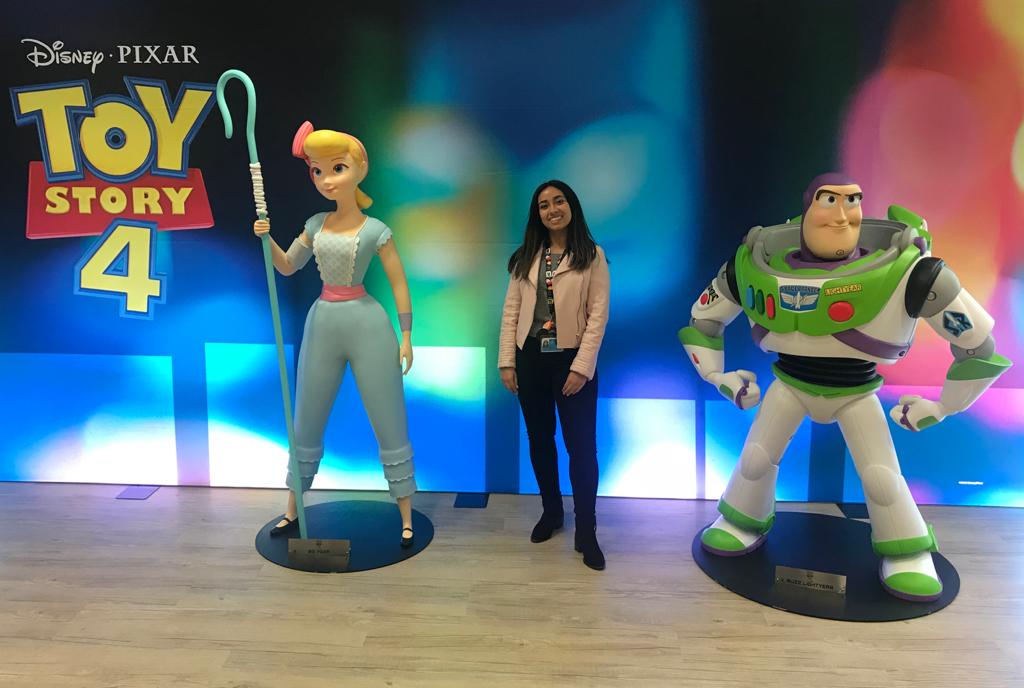 University of Surrey student, Janhvi standing next to Little Bo Peep and Buzz Lightyear from Toy Story 4