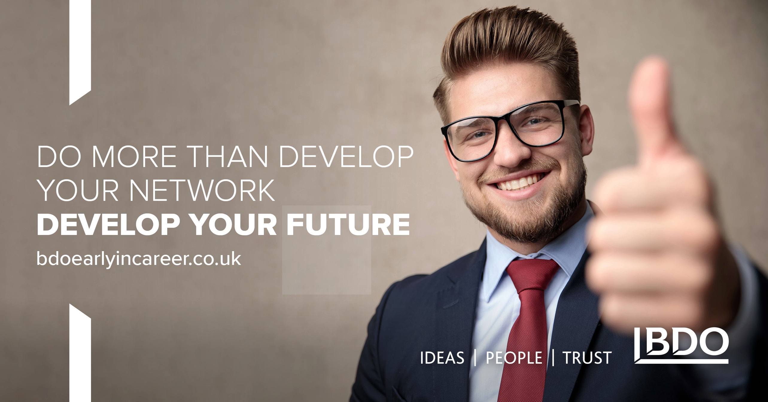 Smartly  dressed man with thumbs up and smiling face. Writing says ' Do more than develop your network. Develop your Future.'