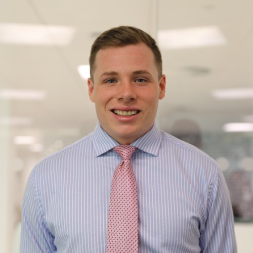 Portrait photo of Chemistry graduate, Pete. Pete is wearing a shirt and tie.