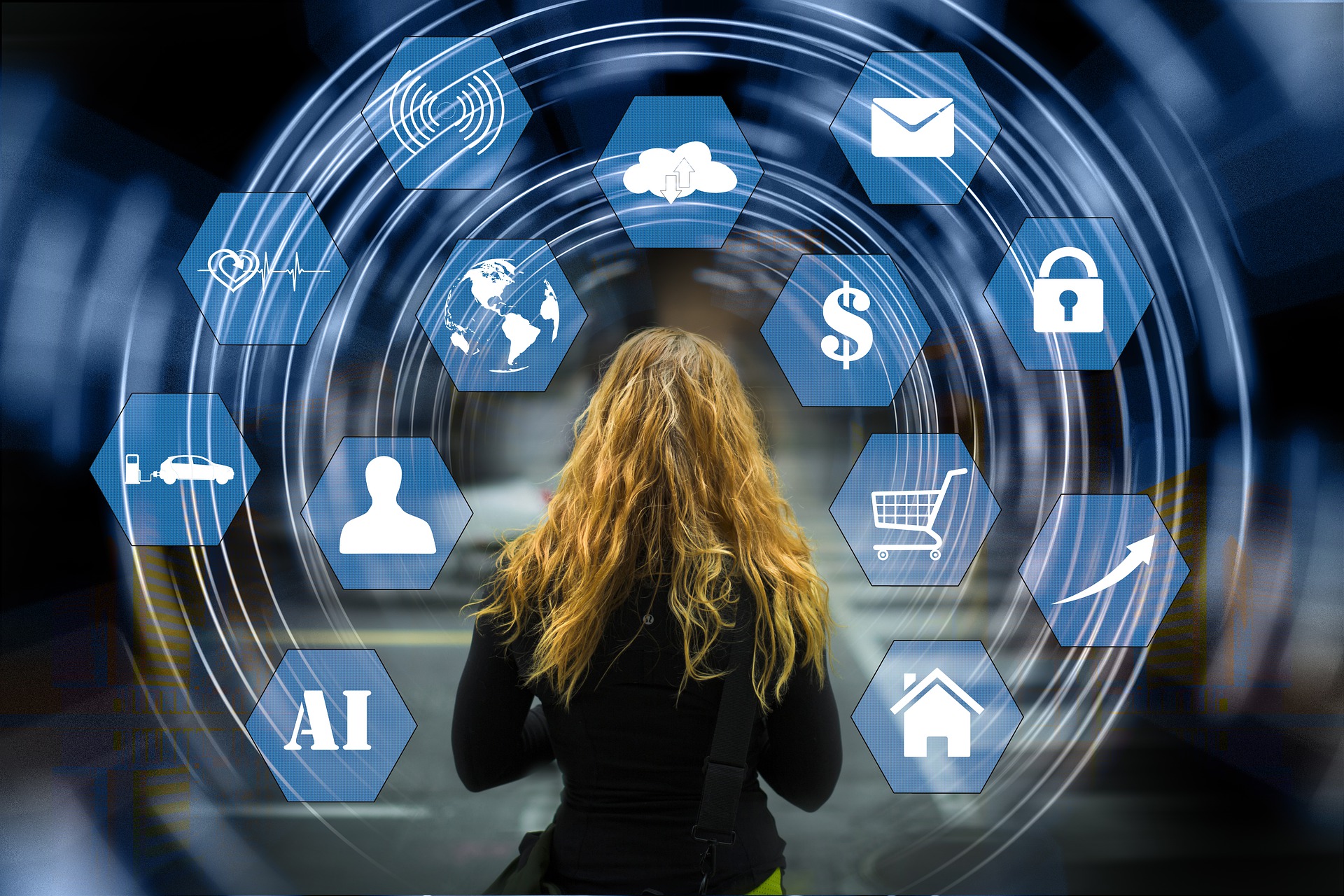 woman facing away looking at various tech type images in hexagons