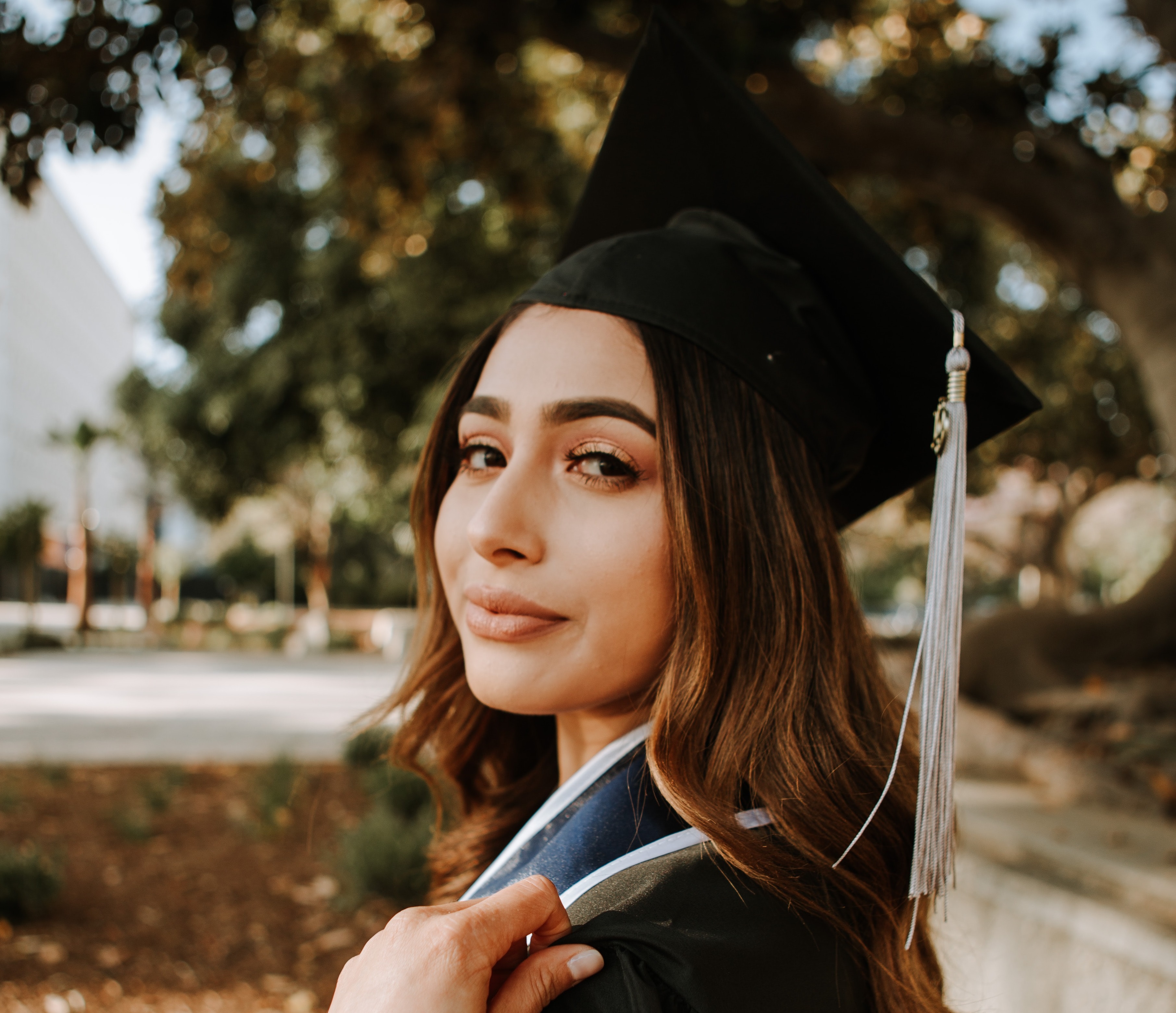 Picture of a young woman wearing a graduation cap