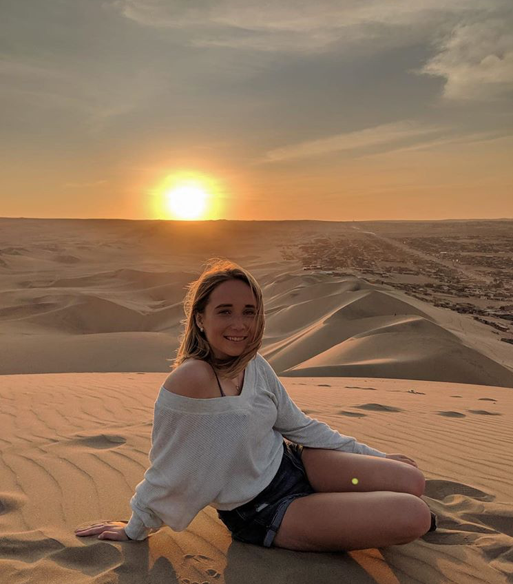 Picture of me sitting on a sand dune at sunset
