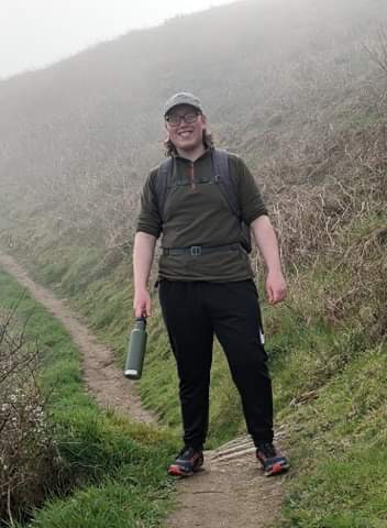 An image of me stood on a hiking trail, taking part in the Kaluza Charity challenge - a 20km coastal walk raising £200!
