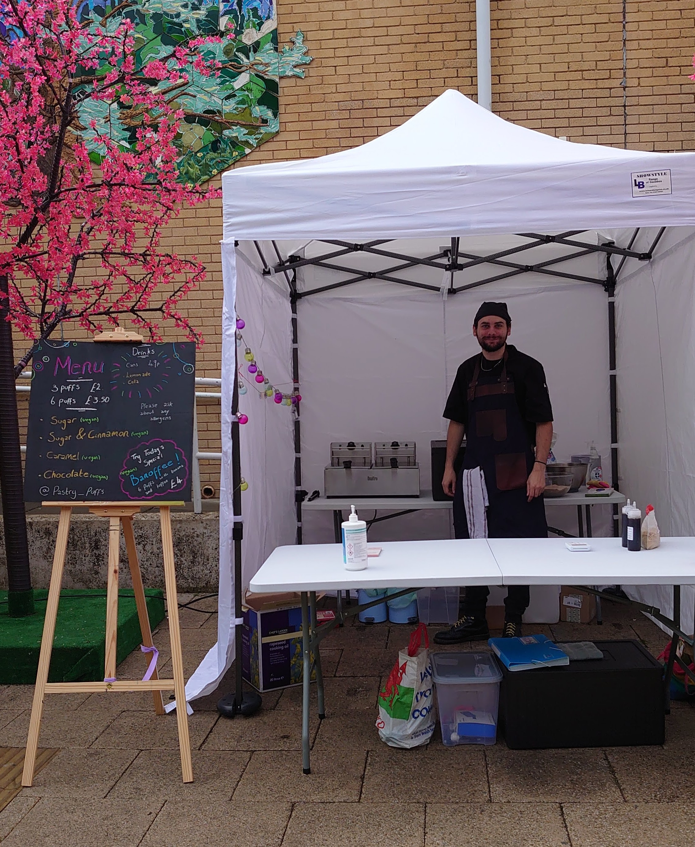 Lewis from Pastry Puffs working on his stall at the Thursday market at the University of Surrey