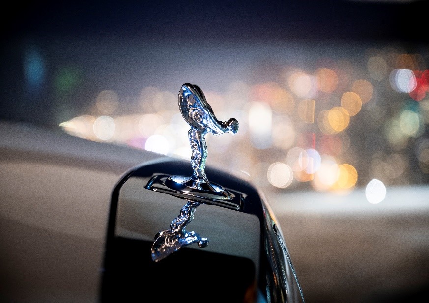 The spirit of ecstasy mascot on the front of a Rolls-Royce car