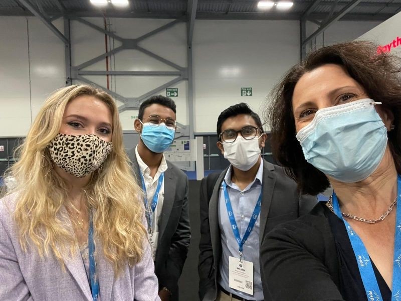 The Clutch Space team wearing face masks at an expo this summer