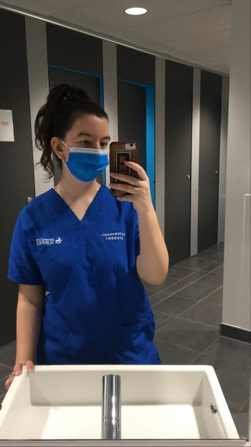 Vet Student wearing uniform and face masking