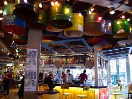 Turtle Bay Guildford location with fairy lights, steel brums on ceiling and a very pretty aesthetic