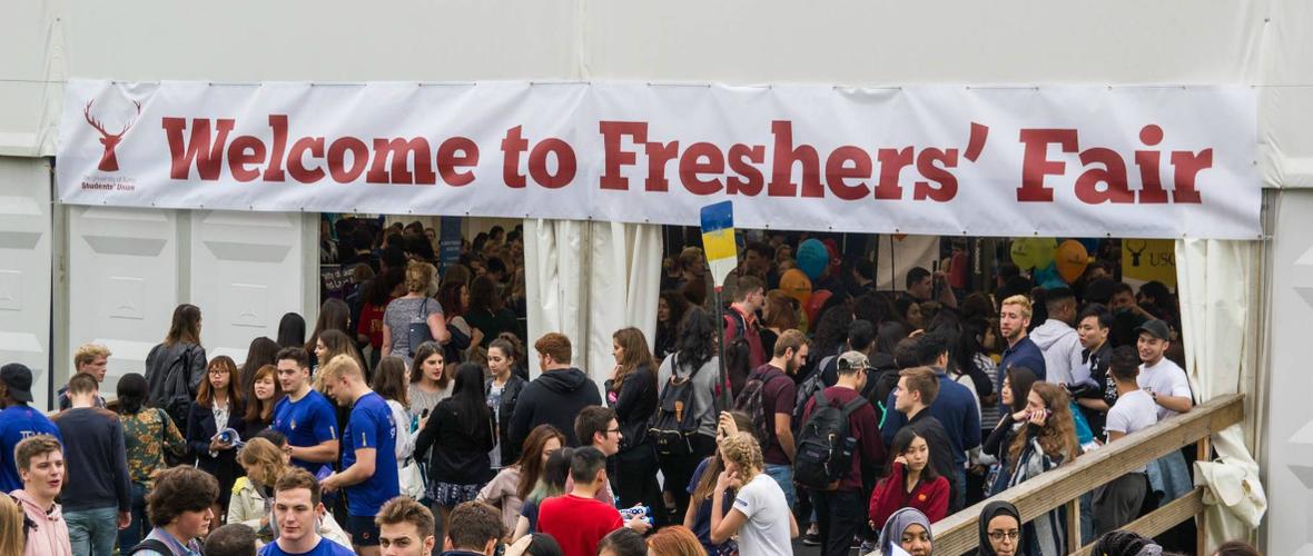 Freshers Fair USSU lots of people inside marquee trying out societies 