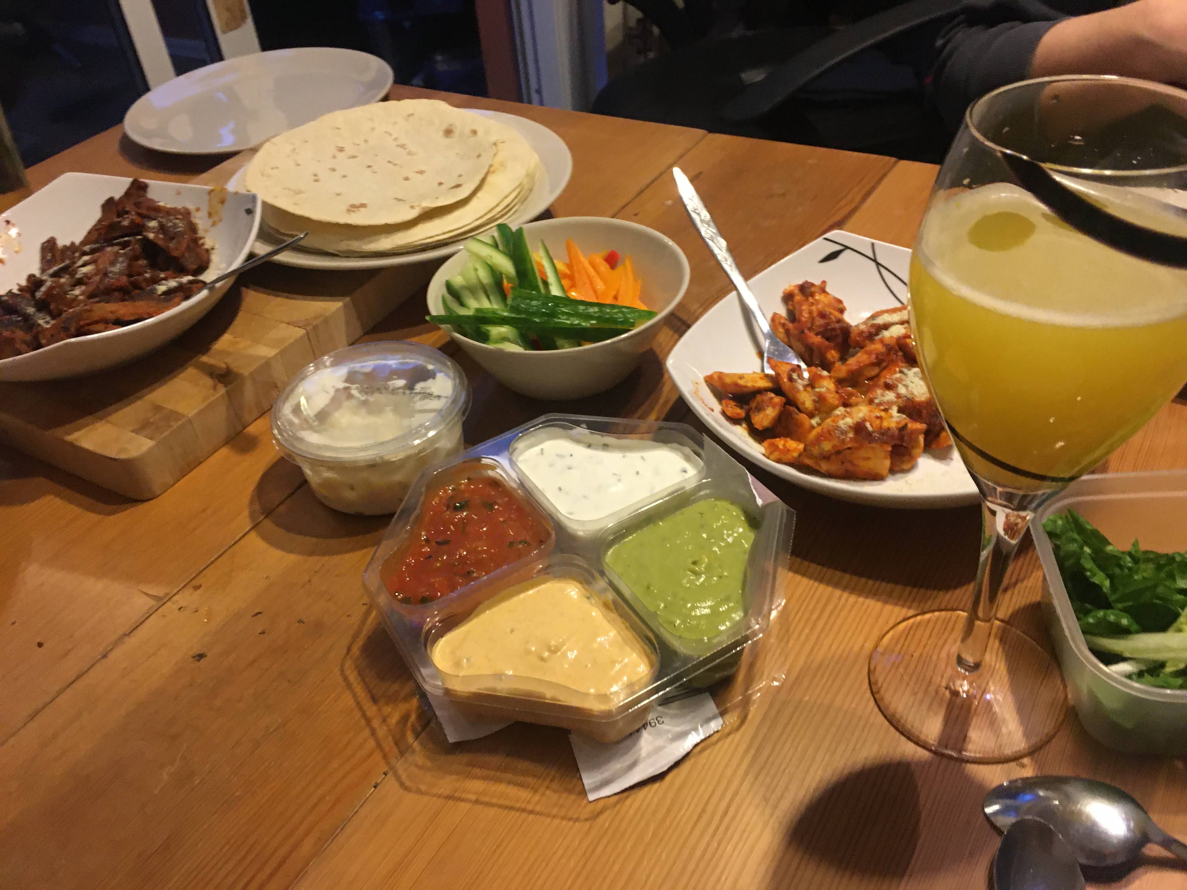 Photo of fajitas with dips and vegetables 