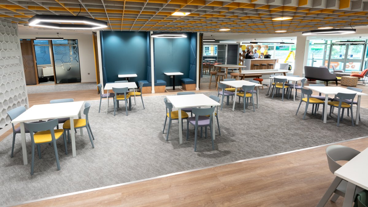 MySurrey Hive with tables and booths for studying and socialising. Very nicely decorated with honeycomb design