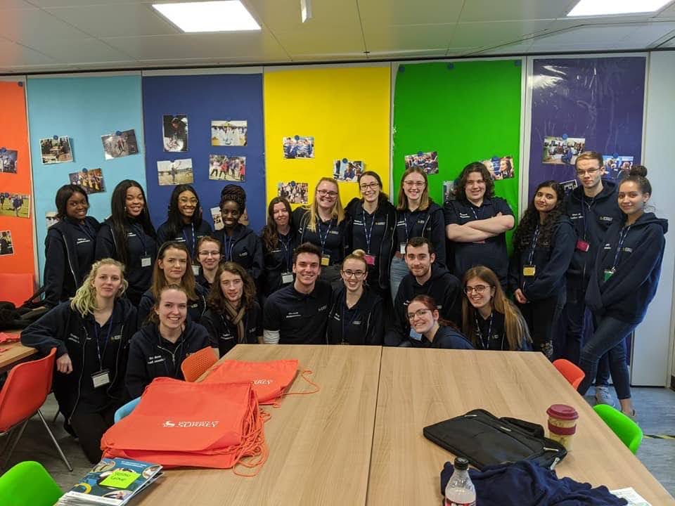 Group of University of Surrey Student Ambassadors smiling after working on a project together