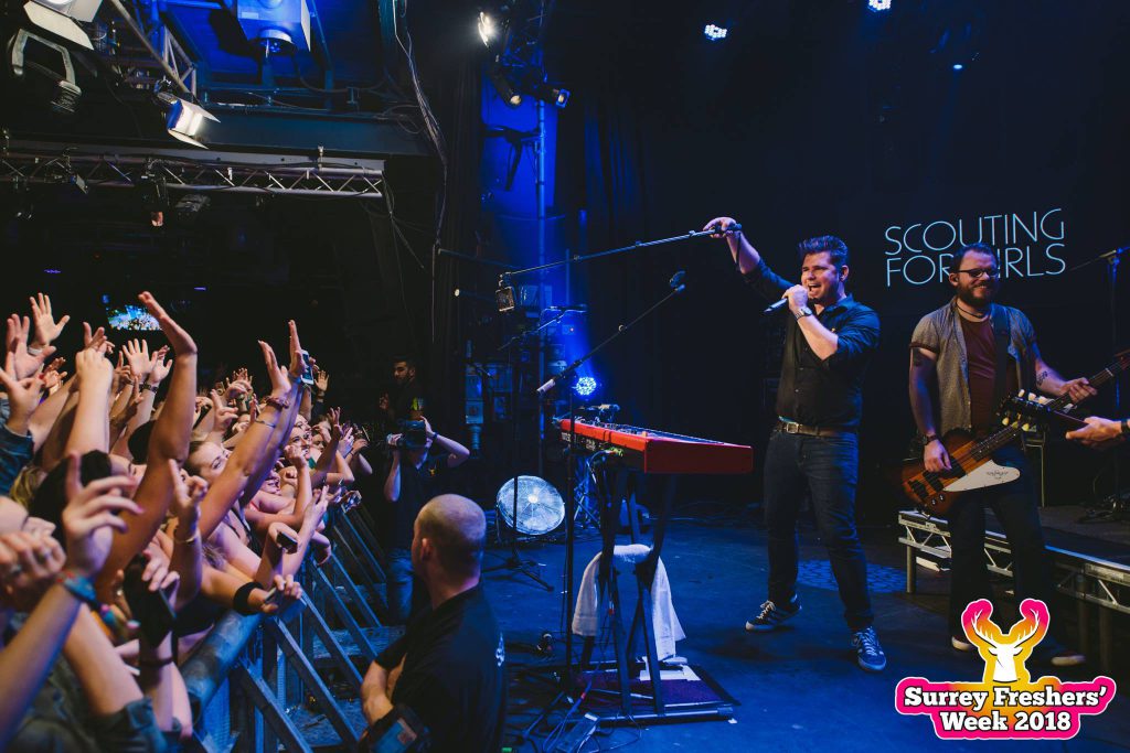 Scouting for Girls band performing at Rubix USSU in front of crowd dancing 