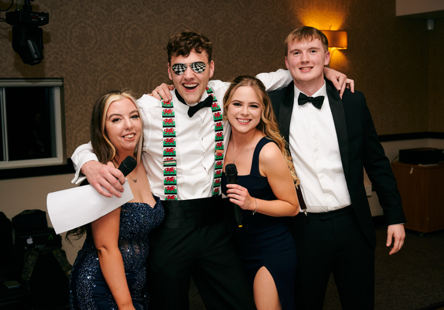 Group of students in formal wear at awards evening as part of the University of Surrey Veterinary Society