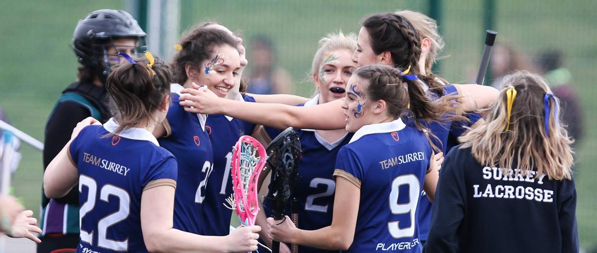 Team Surrey Womens Lacrosse celebrating after a goal 